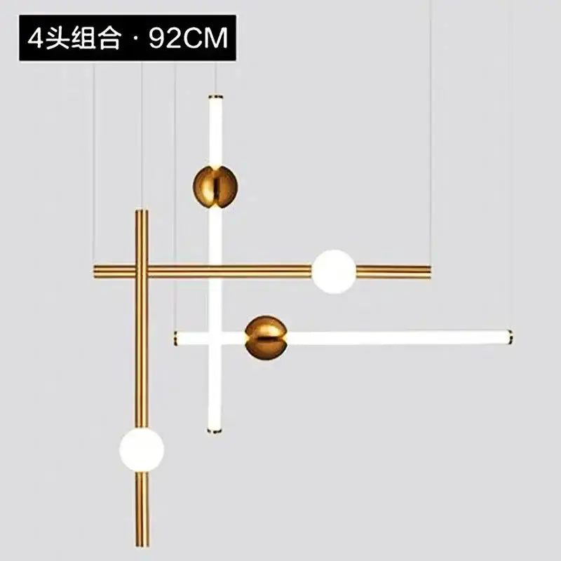 Modern gold geometric line frame pendant lights with gold metal rods and white cylindrical fixtures for dining room use