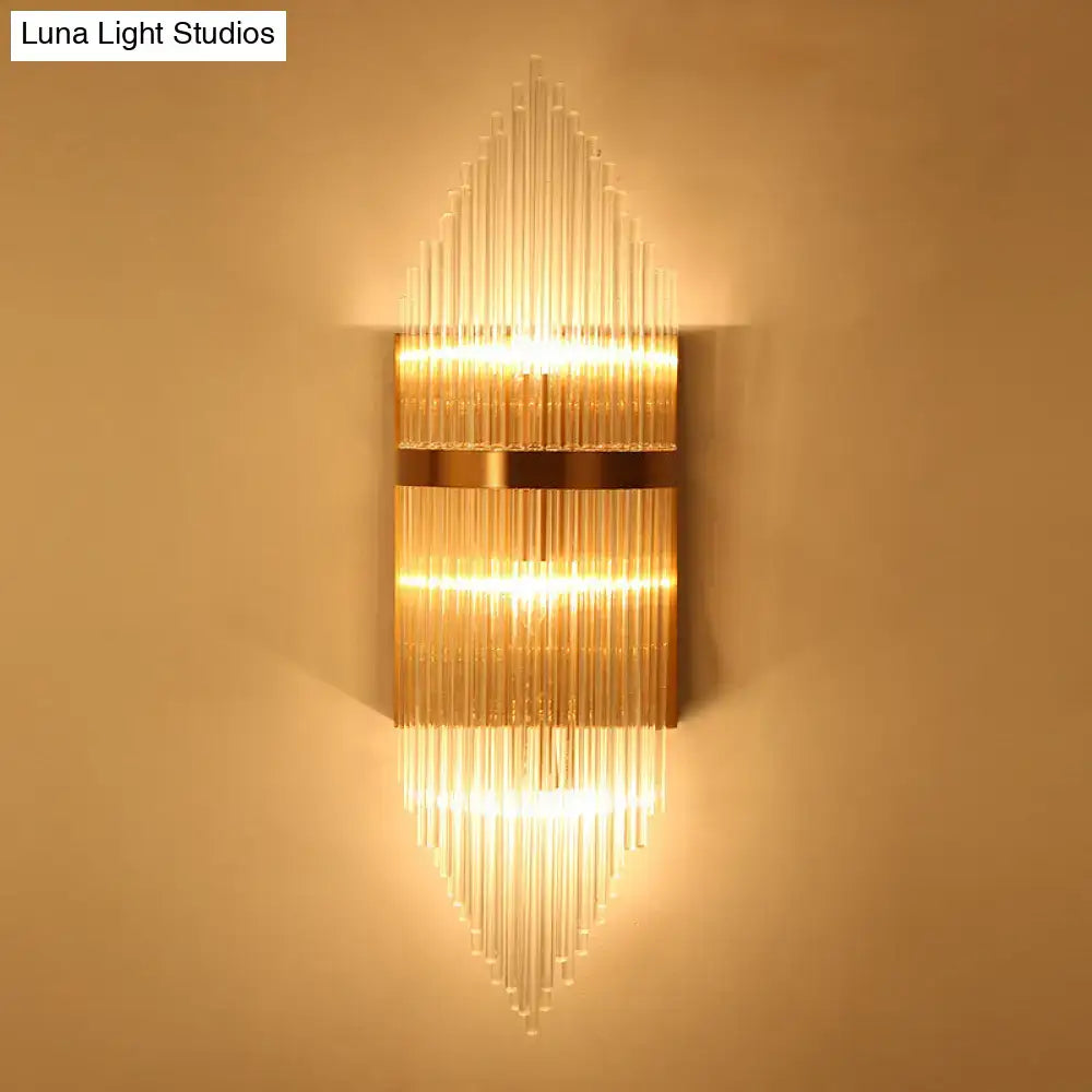 Modern gold geometric wall sconce with clear glass rods and horizontal metal bands featuring fixture height detail