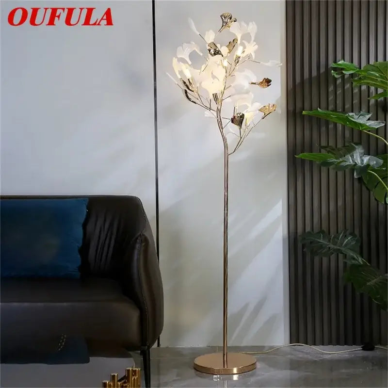 Oufula floor lamp with slender gold metal stem and white ginkgo flower light fixtures for modern living room decorbites ginkgo flower