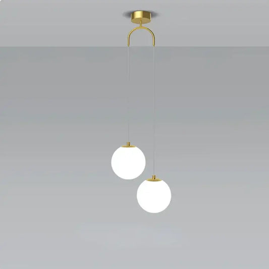 Modern gold-toned glass ball dual head pendant light with frosted glass shades for bedroom decorbites pendant light