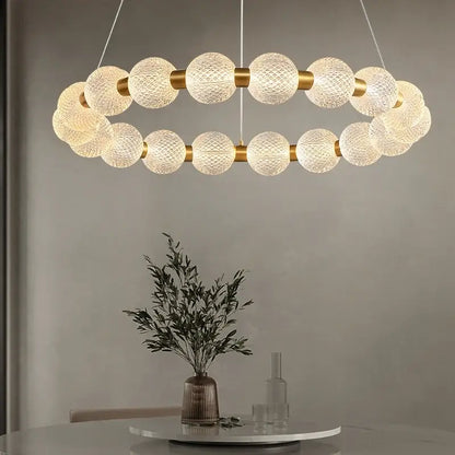 A modern gold glass ball led ceiling chandelier with frosted glass spheres and metal accents for living room decorbites