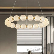 Modern gold glass ball led ceiling chandelier with textured white glass spheres and gold-toned metal connectors decorbites glass ball