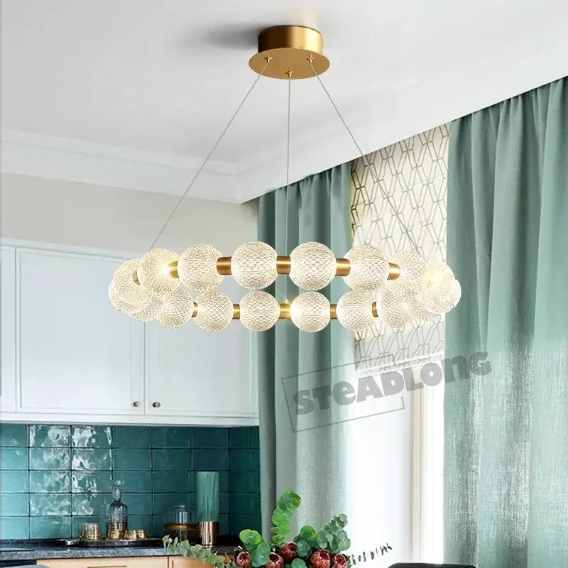 Modern gold glass ball led ceiling chandelier with spherical textured glass orbs in a double-circle design by decorbites