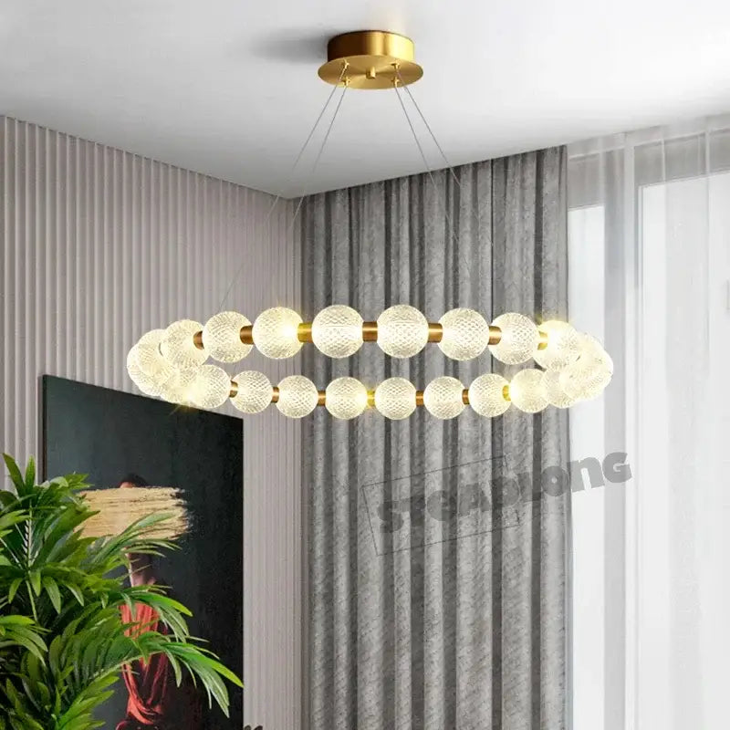 Modern gold-toned double-ring ceiling chandelier with decorbites glass ball led frosted glass spheres for living room decor