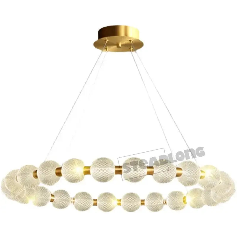 Modern gold glass ball led ceiling chandelier with textured frosted glass spheres and brass accents by decorbites