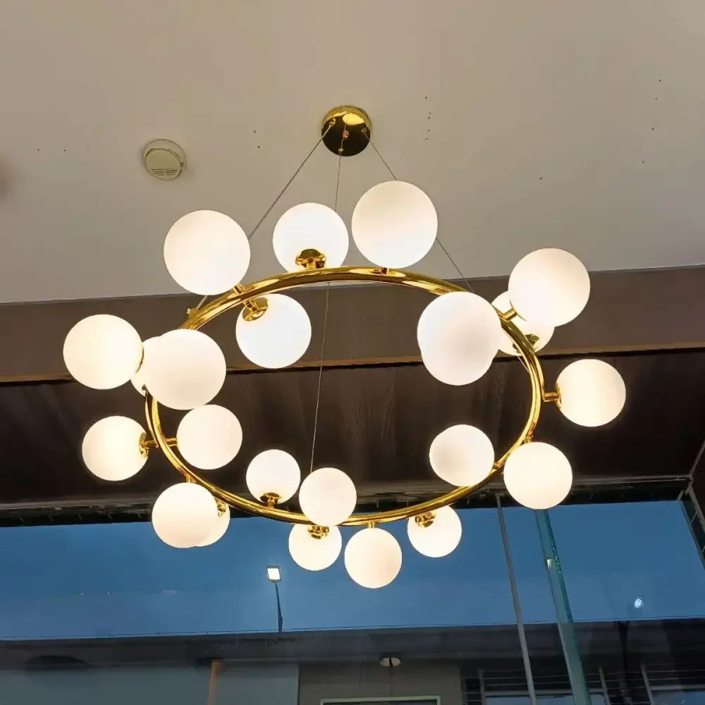 Modern gold glass ball led chandelier with frosted globe bulbs arranged in a circular pattern for dining room decorbites glass ball