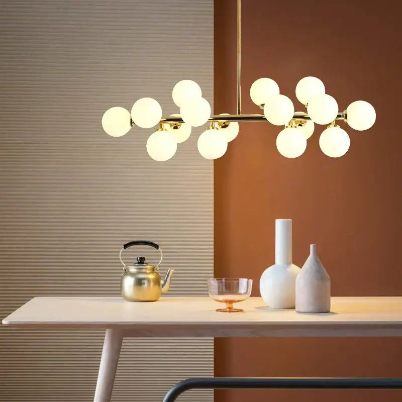 Modern gold glass ball led chandelier with frosted spherical bulbs in a branching design for dining room decorbites glass ball