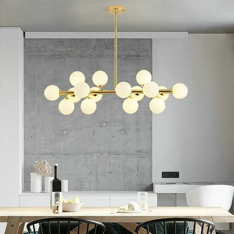 Modern gold glass ball led chandelier with frosted globe bulbs in a branching design for kitchen and dining room decorbites glass ball
