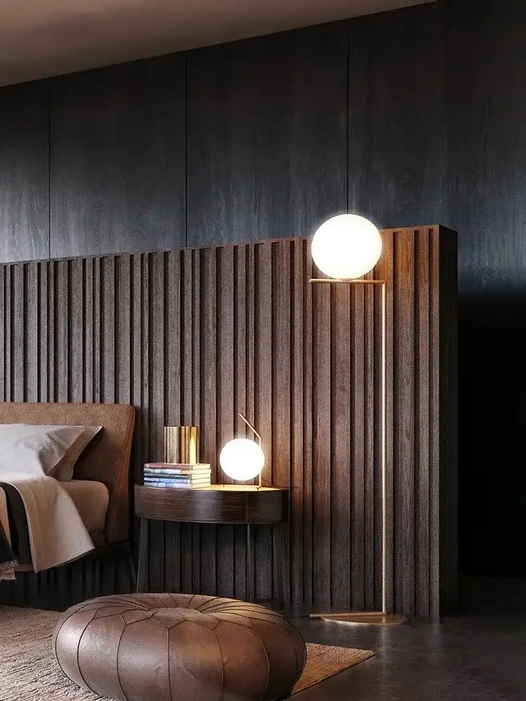 Modern gold floor lamp with a spherical white glass ball led shade and slender metal stand for chandelier light decorbites