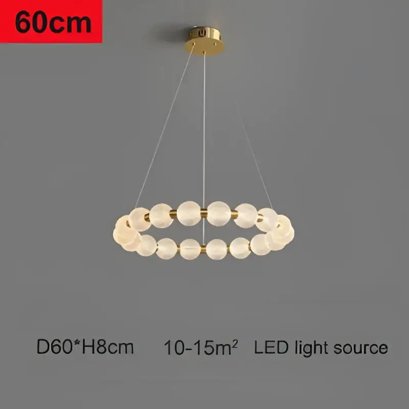 Modern gold glass ball led chandelier featuring circular pendant with translucent textured glass spheres decorbites glass ball