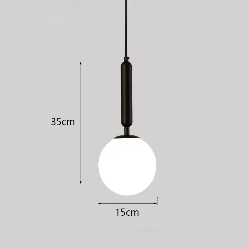 Modern gold glass ball led pendant light featuring a black matte metal fixture and spherical frosted glass globe decorbites glass ball