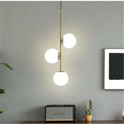 Modern gold glass ball led pendant light with three glowing white spherical glass bulbs for living room decorbites pendant light