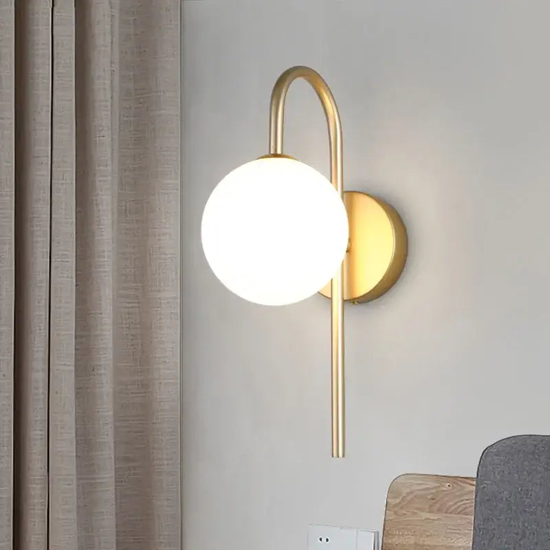 Modern gold wall sconce with curved arm and frosted glass ball led shade for living room decorbites glass ball lighting