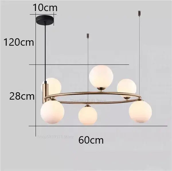 Modern gold glass ball pendant chandelier with five frosted glass globe lights in brass-toned finish for dining room decorbites glass ball