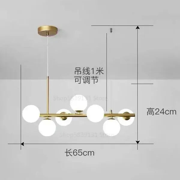 Modern gold glass ball pendant chandelier with six frosted glass globe bulbs in a linear decorbites glass ball design