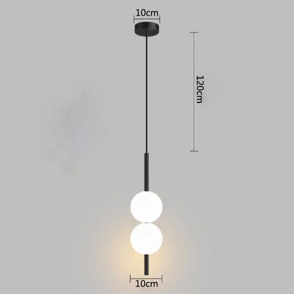 Minimalist black pendant light with two glowing white glass ball bulbs by decorbites for modern bedroom decor