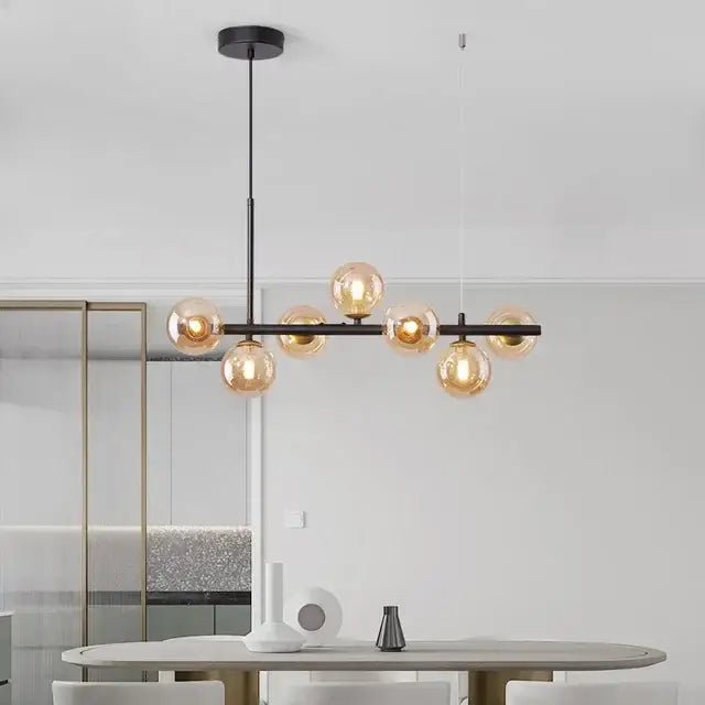 Modern black metal pendant light chandelier with amber glass ball bulbs perfect for dining room decorbites glass ball