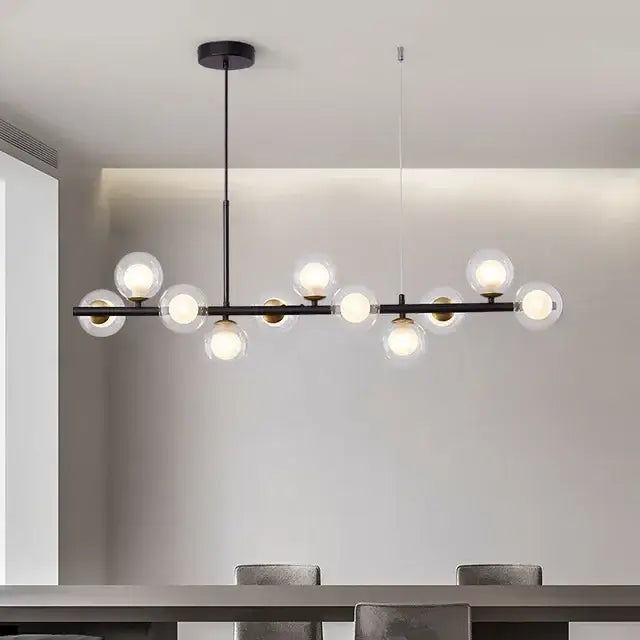 Modern black metal pendant light with clear glass ball bulbs for elegant dining room decorbites glass ball fixture