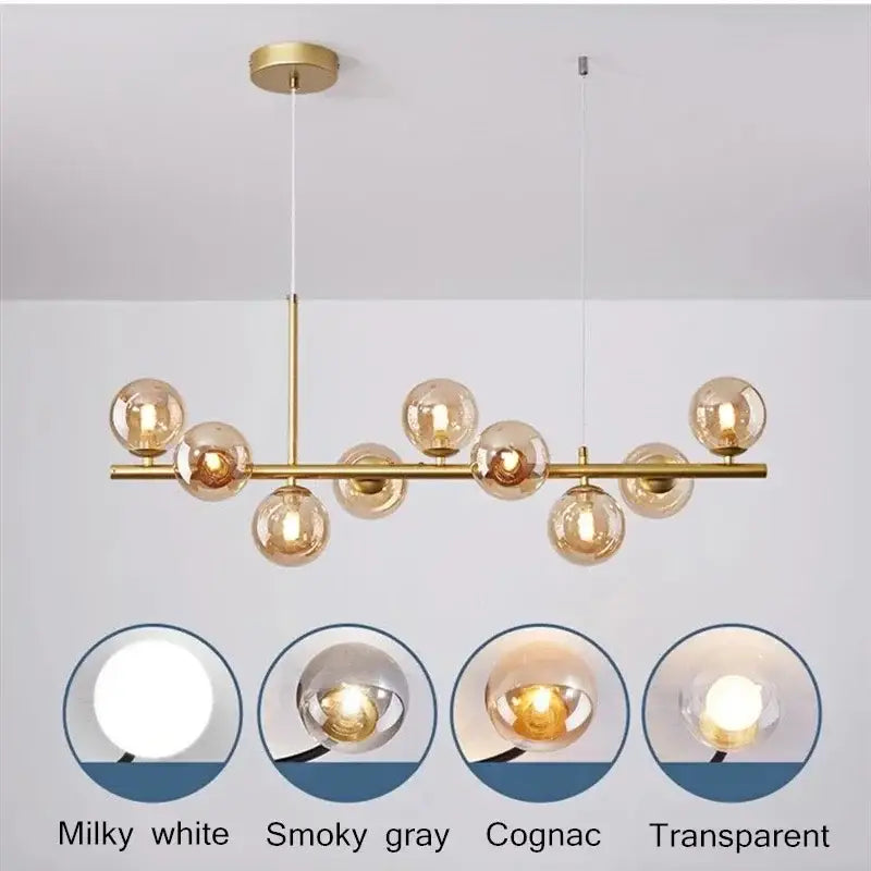 Modern gold pendant light with glass ball globes in a linear design perfect for dining room decorbites glass ball