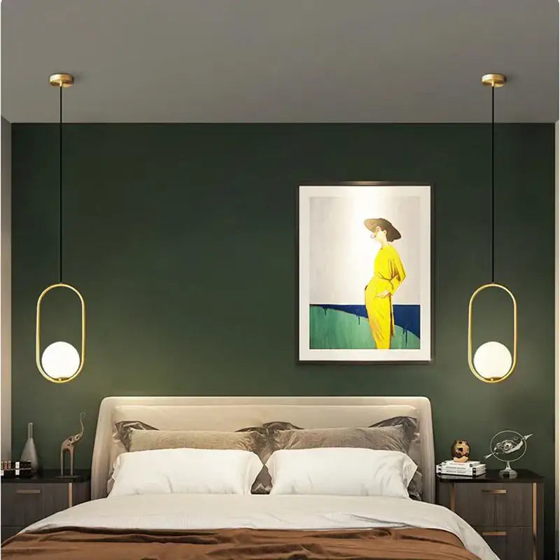 Modern gold glass ball pendant lights with frosted glass globes hang symmetrically as decorbites glass ball pendant lights