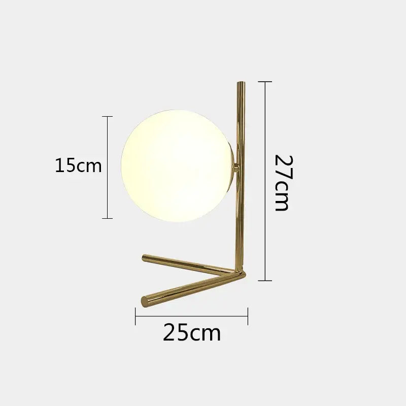 Modern gold glass ball table lamp with frosted globe shade and slender metal base ideal for bedroom decorbites decor