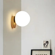 Modern gold glass ball wall lamp with frosted glass globe for bedroom featuring decorbites glass ball design wall lamp