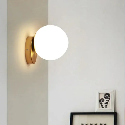 Modern gold glass ball wall lamp with frosted glass globe for bedroom featuring decorbites glass ball design wall lamp