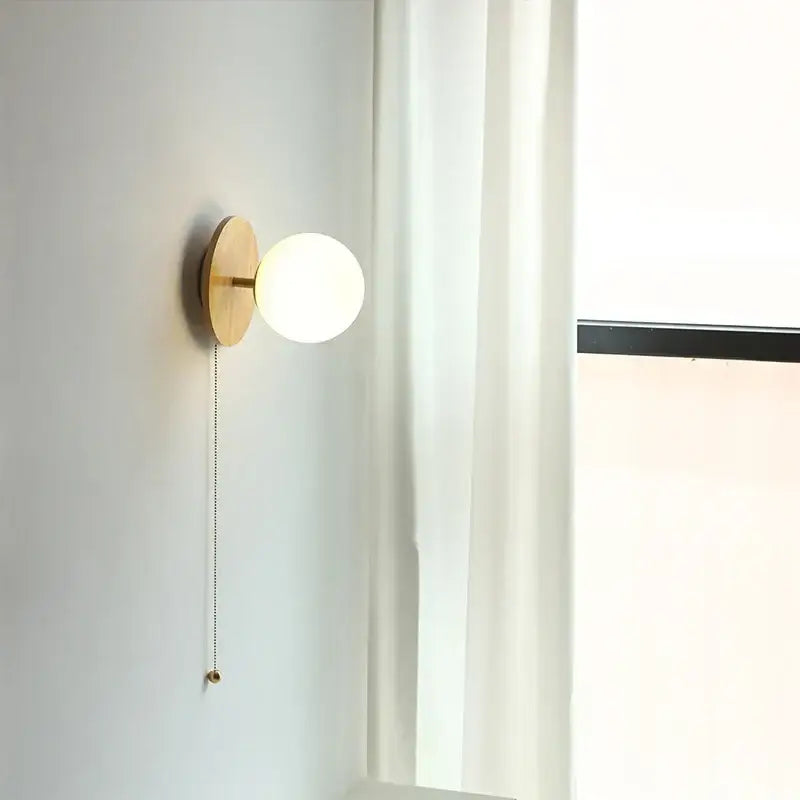 Minimalist wall lights with a round frosted glass ball and natural wood base perfect for bedroom decorbites glass ball