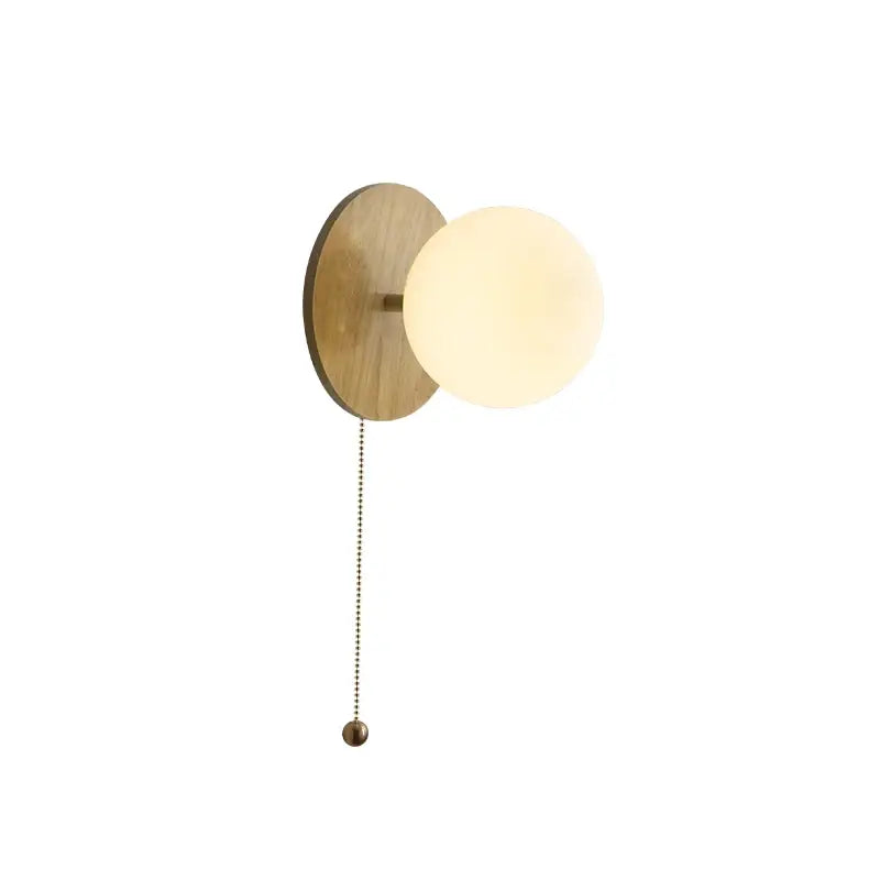 Modern gold glass ball wall lights with warm wooden backplate and softly glowing glass ball for bedroom decorbites wall lights