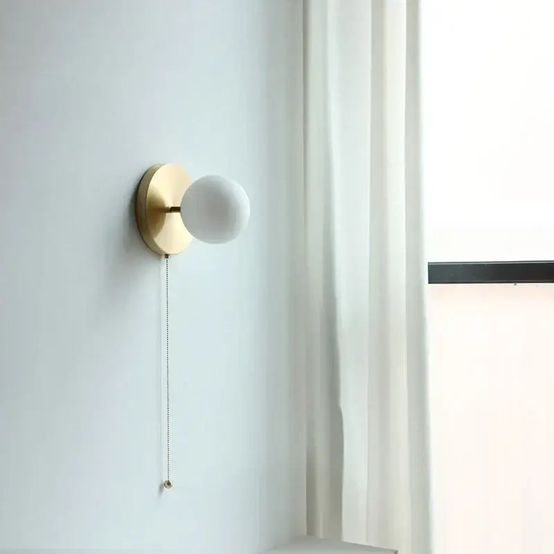 Modern gold wall lights with matte white glass ball shade and pull chain ideal for bedroom decorbites glass ball