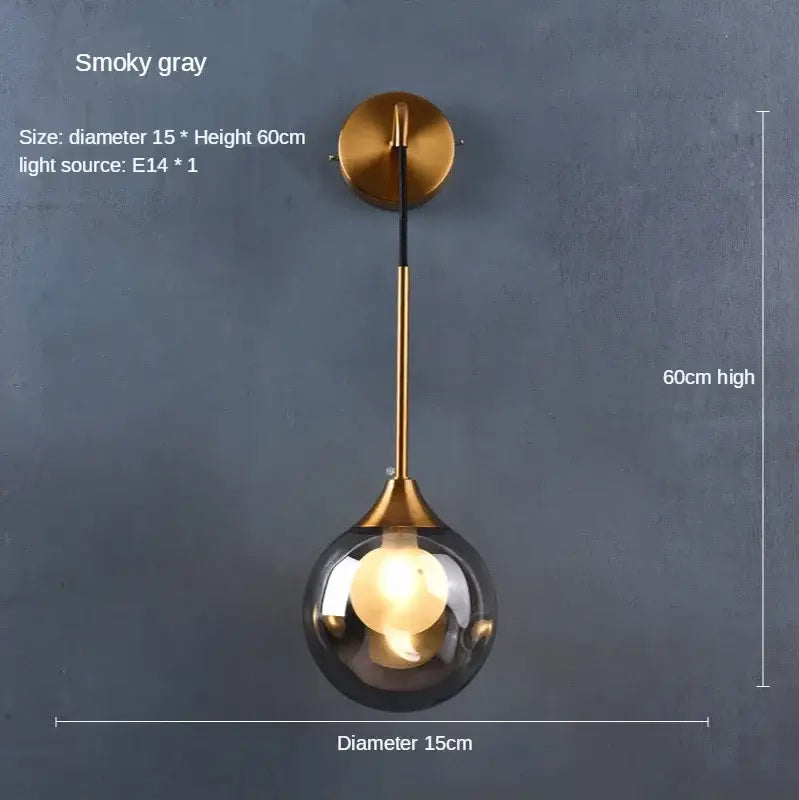 Modern gold glass ball wall sconce with smoked glass globe and brass finish for stylish bedroom decorbites glass ball lighting