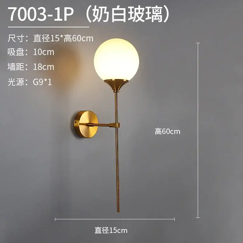 A modern gold glass ball wall sconce with frosted white glass globe and polished brass finish for bedroom decorbites glass ball