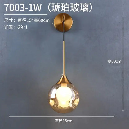 Modern gold glass ball wall sconce with frosted spherical globe and brass-finished stem for elegant bedroom decorbites glass ball lamp