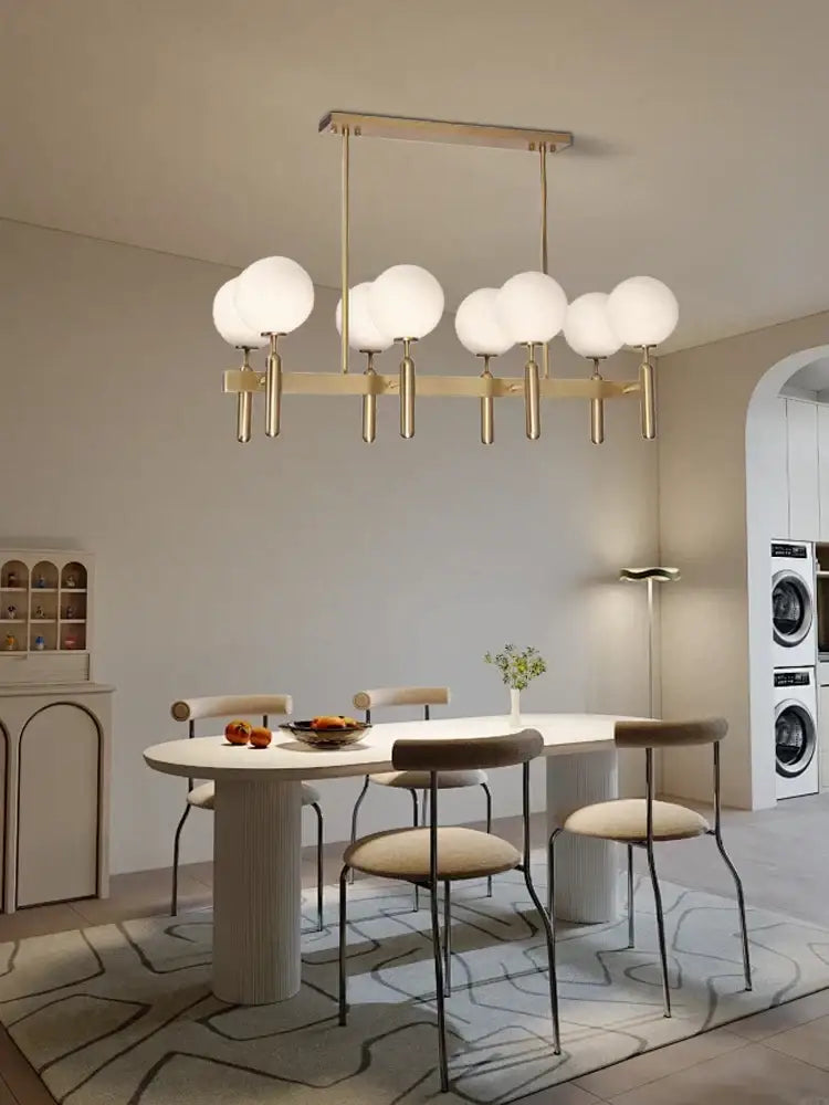 Modern gold glass balloon chandelier with six spherical frosted glass globe lights for elegant dining room decorbites glass balloon