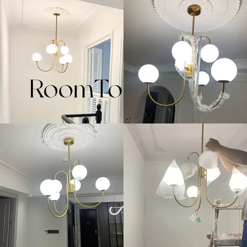 Modern gold glass balls chandelier pendant light with multiple white glass shades and curved metal arms for dining room decorbites