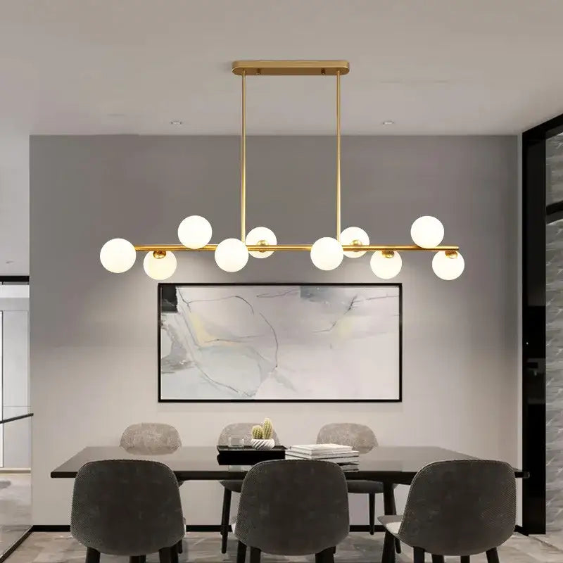 Modern gold glass balls chandelier with nine frosted glass globes in a linear design for dining room decorbites glass balls