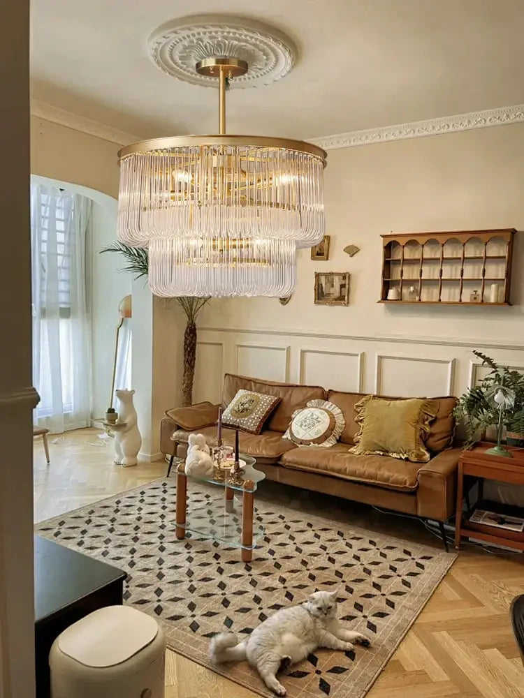 Modern gold glass bar chandelier with cascading crystal strands hanging from decorative ceiling medallion decorbites glass bar