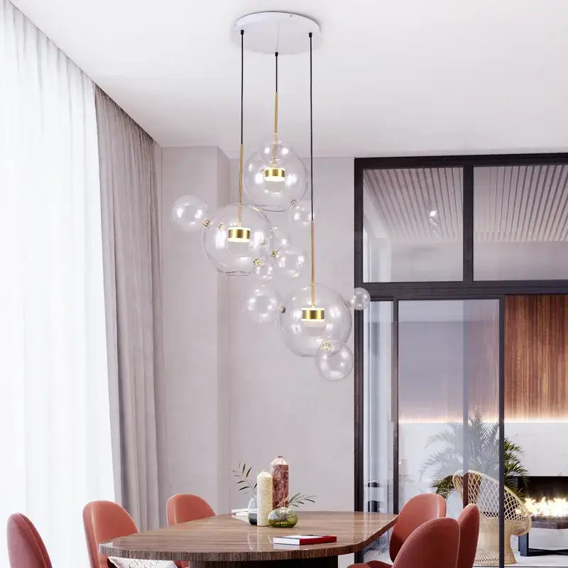 Modern gold glass bubble ball led chandelier with decorbites glass bubble design hanging from white ceiling fixture