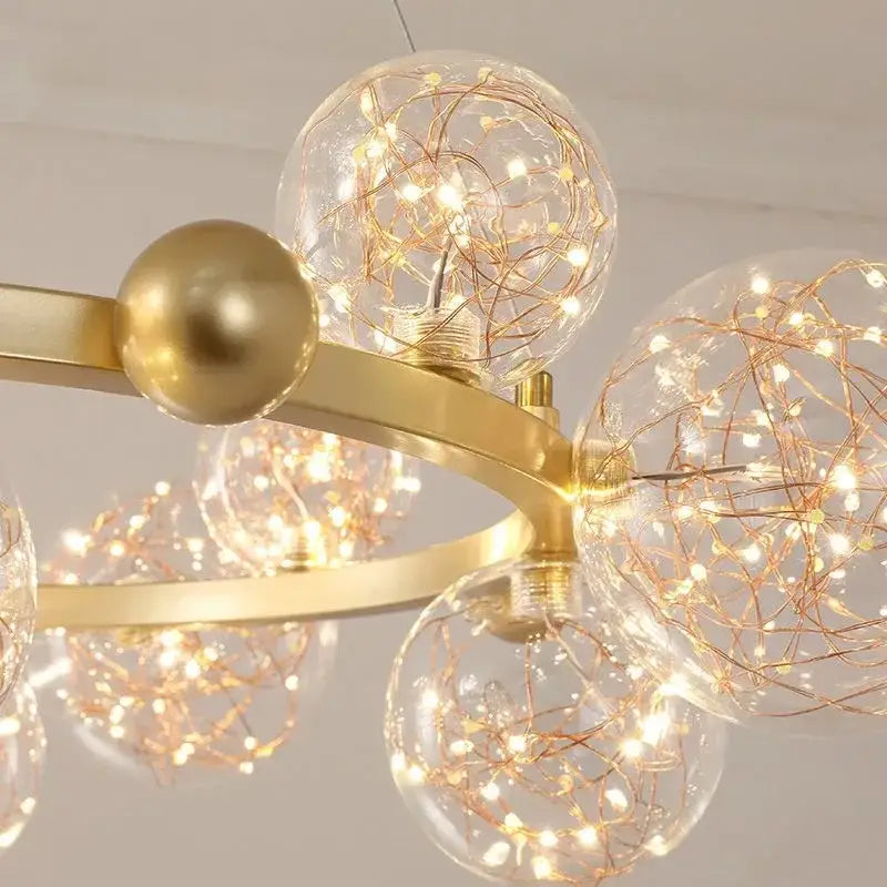 Modern gold glass bubble led chandelier featuring clear glass spheres with copper wire fairy lights for dining room decorbites