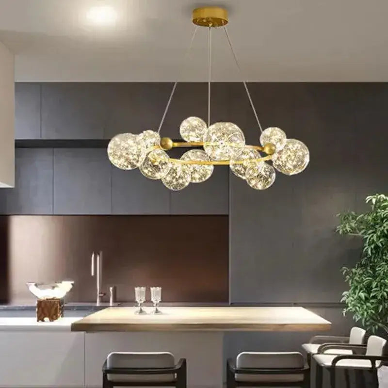 Modern gold glass bubble led chandelier with clear bubble spheres suspended from a circular frame for dining room decorbites glass bubble
