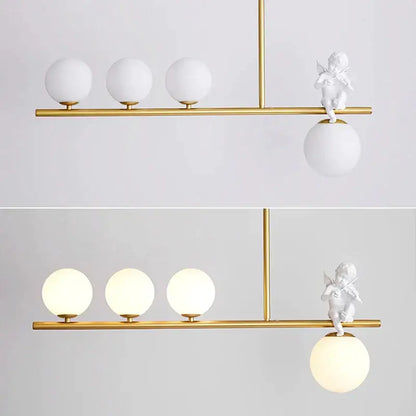 Modern gold glass bubble pendant light with three frosted globes and a white cherub decorbites glass bubble accent