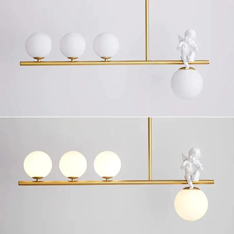 Modern gold glass bubble pendant light with three frosted globes and a white cherub decorbites glass bubble accent