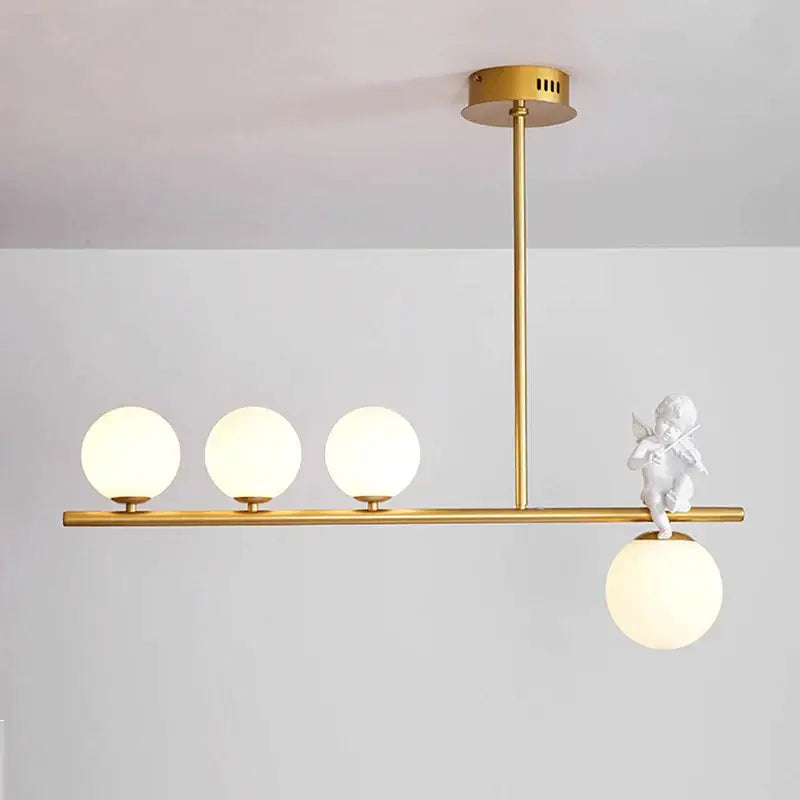 Modern gold glass bubble pendant light with three frosted glass globes and a white cherub decorbites glass bubble detail