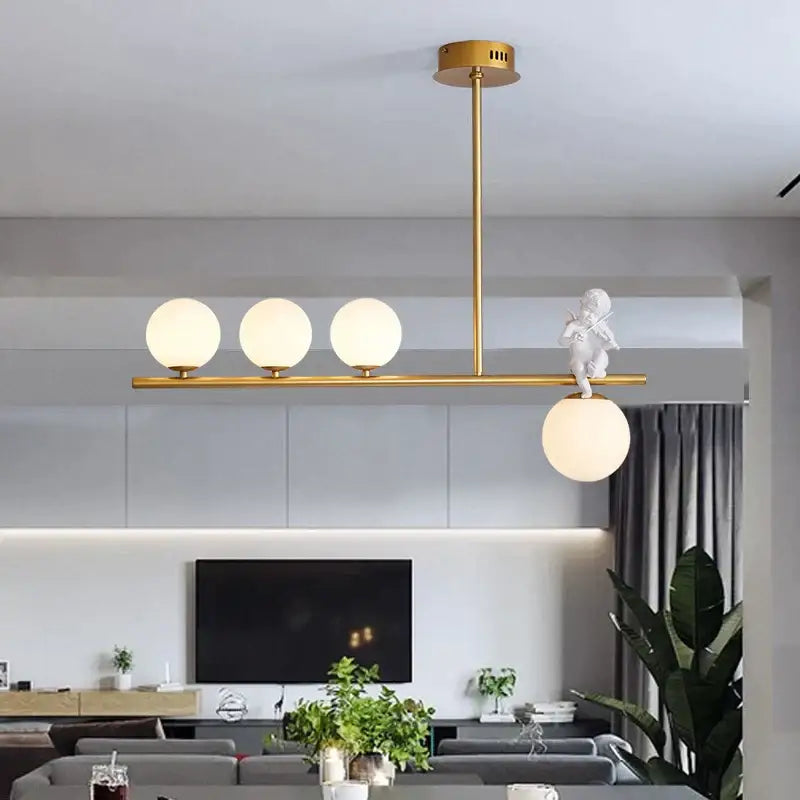 Modern gold glass bubble pendant light with four frosted globes and white cherub decorbites glass bubble detail