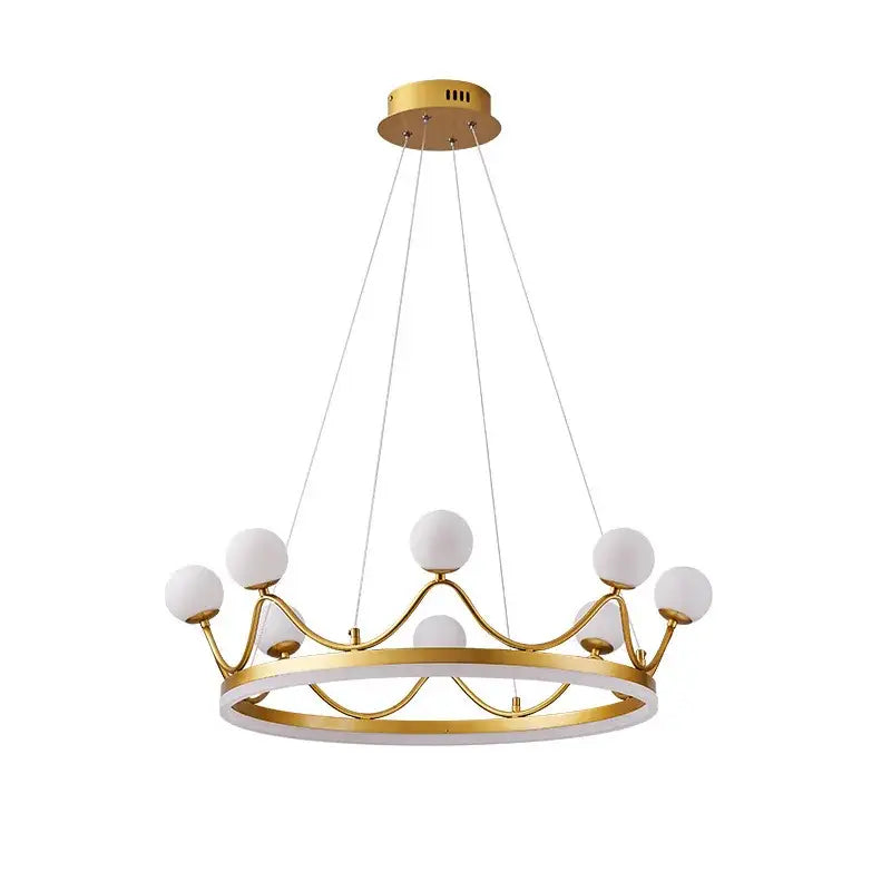 Modern gold glass crown chandelier with white spherical shades featuring a minimalist bedroom pendant light design