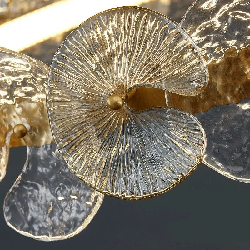 Modern gold glass flower led chandelier featuring clear textured glass orchid shape with gold metallic accents for living room
