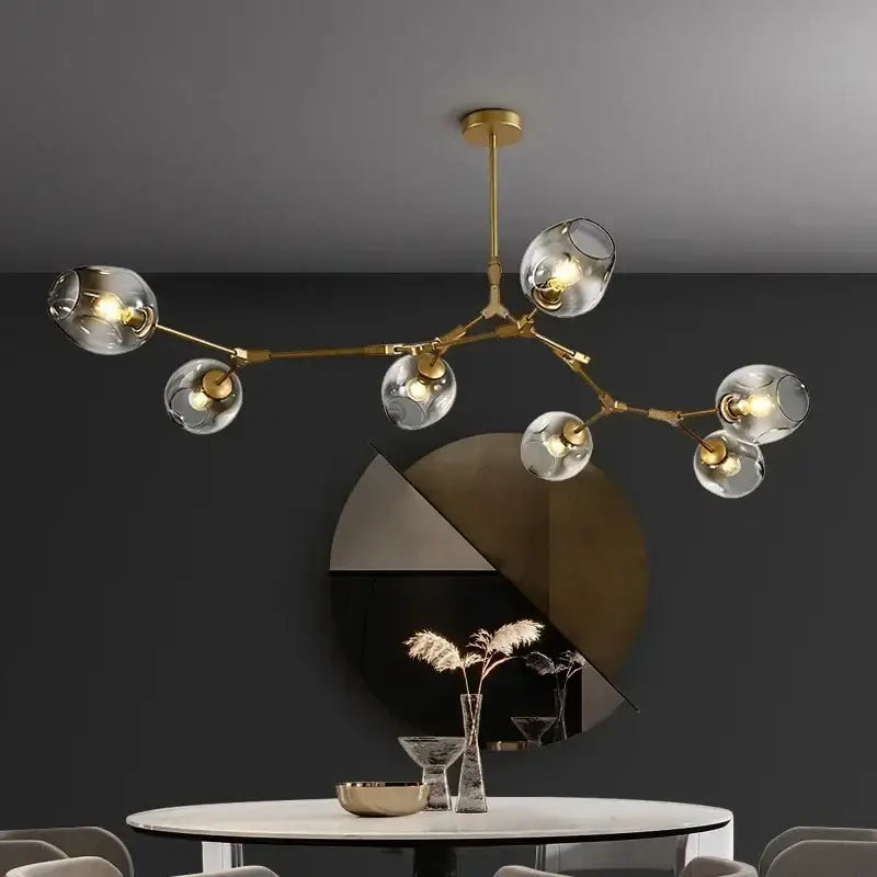 Modern gold glass led ceiling chandelier with multiple clear glass globe shades for dining room lighting