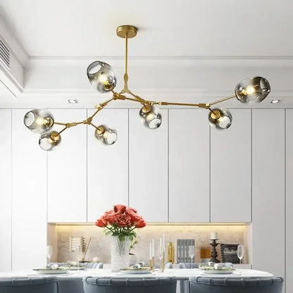 Modern gold glass led ceiling chandelier with multiple spherical glass shades for dining room lighting