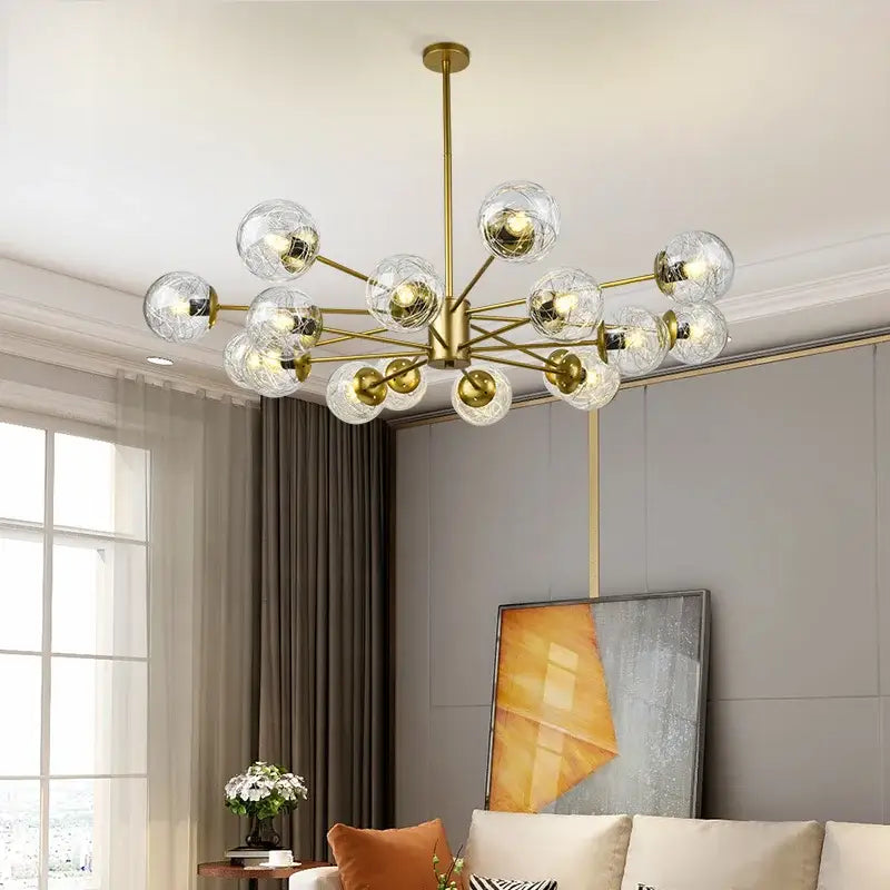 Modern gold glass led chandelier with clear globe bulbs in a branching design for modern dining room pendant light