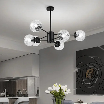 Black metal glass led chandelier with six clear globe shades and internal wireframe for modern dining room use